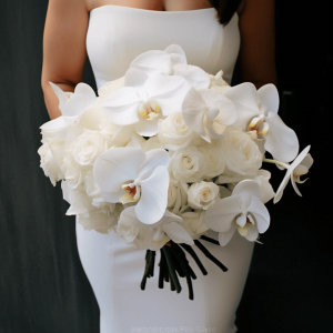 white roses and white orchids bridal bouquet by Flower Club studio